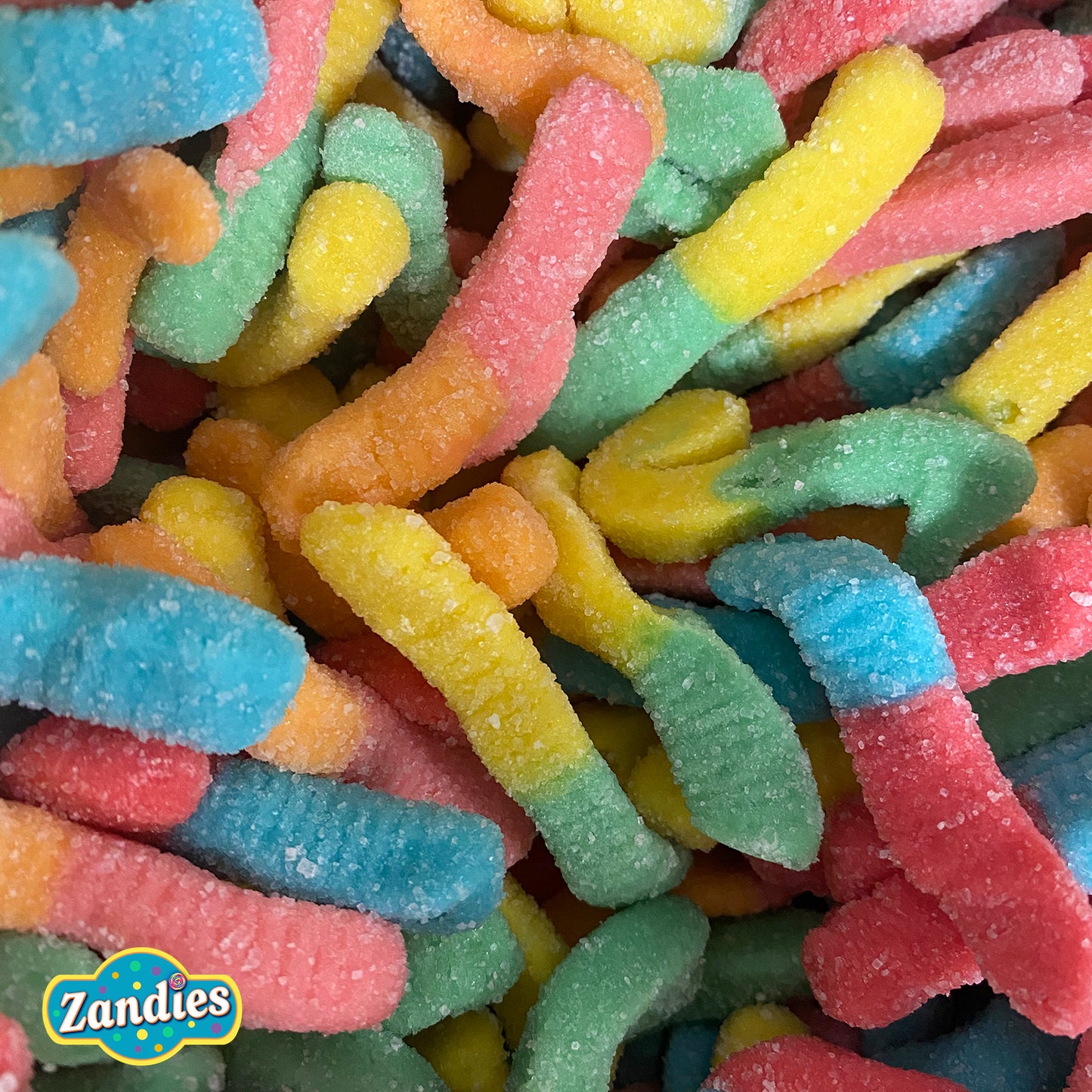 Colorful gummy worms with Zandies logo in the corner