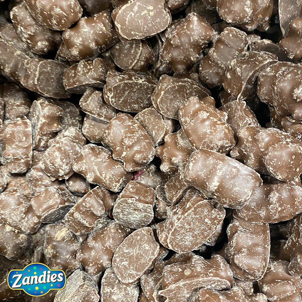 Close-up of Zandies chocolate-covered Cinnamon Gummy Bears with a visible brand logo of Zandies.