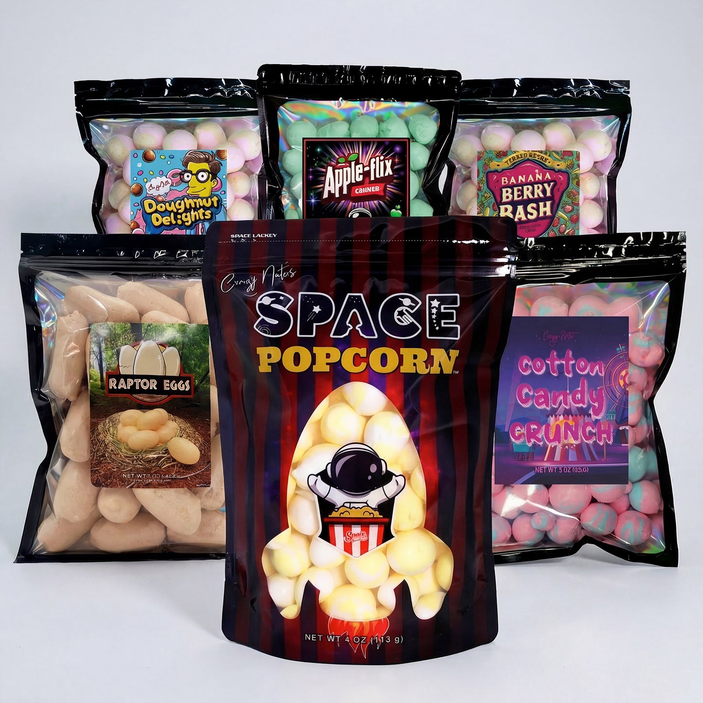 Assorted snack packages including 'Space Popcorn' on a white background