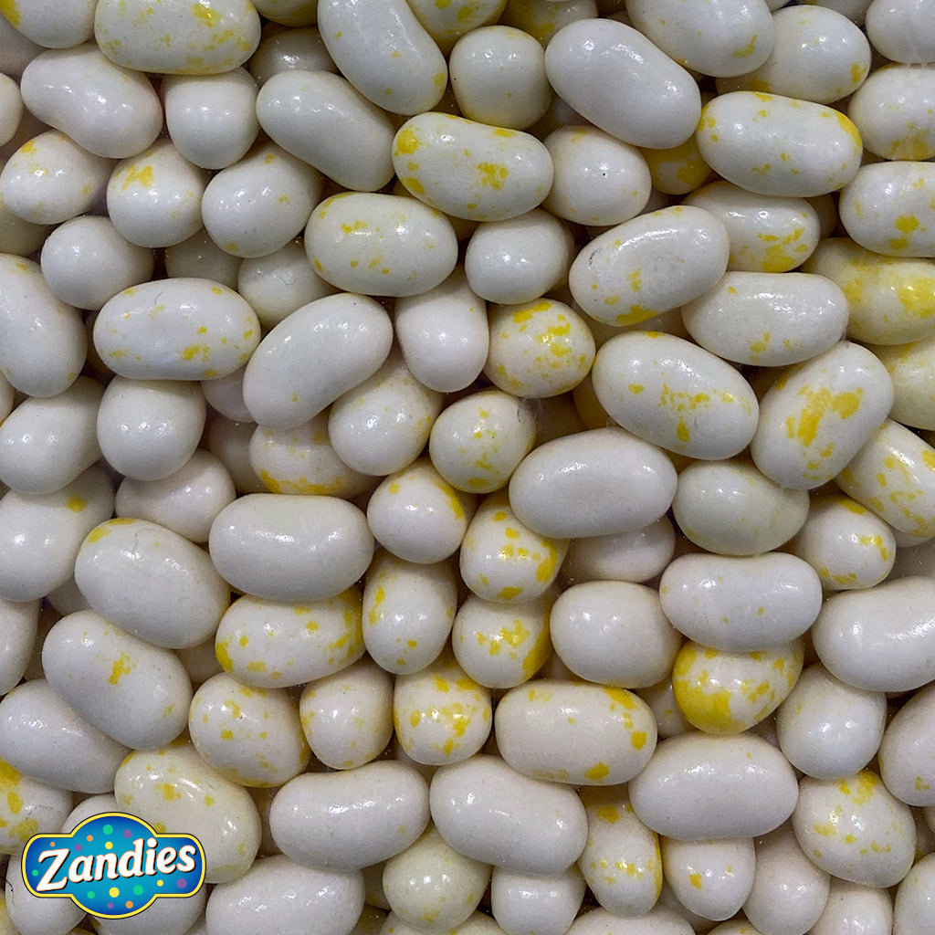 Large pile of Jelly Belly Butter Popcorn Flavor, bulk amount. Zandies logo in the corner