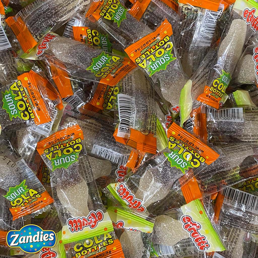 Large pile of Sour Cola Bottles, individually wrapped. Zandies logo in the corner.