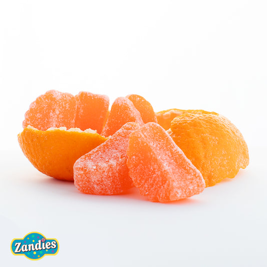 Gummy orange slices candy arranged in a bright citrus-themed display