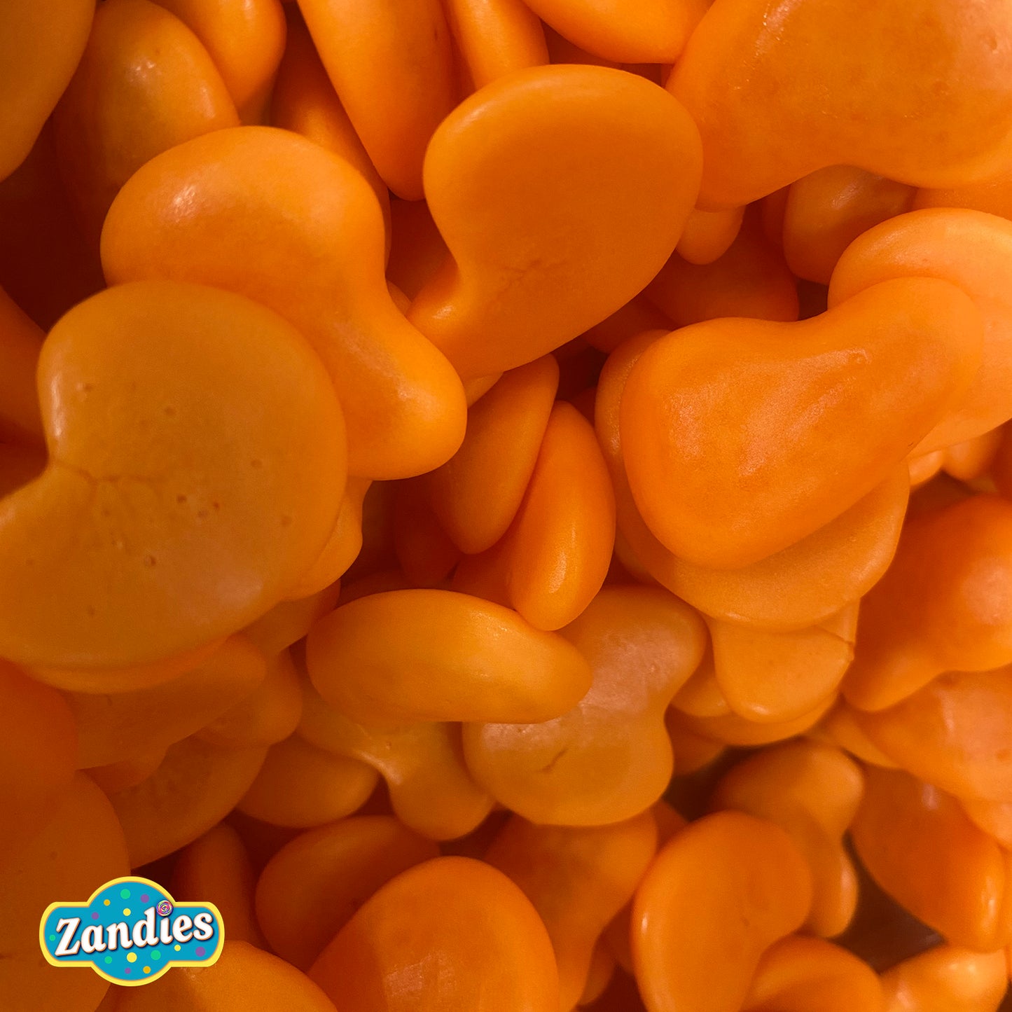 Bulk pile of Vidal spicy mango gummies with chili powder coating