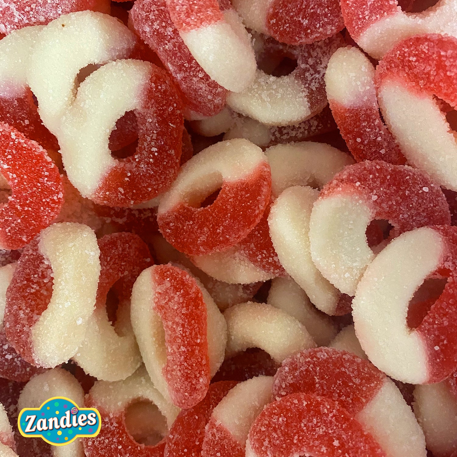 Close-up of red and white Gummi Watermelon Rings candy with Zandies logo.